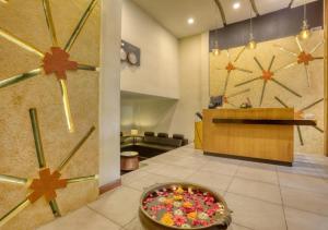 a lobby with a bowl of candy on the floor at Hotel Pearl Palace in Cochin