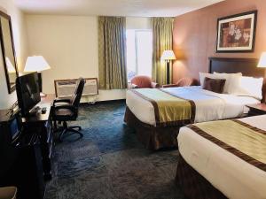 Ένα ή περισσότερα κρεβάτια σε δωμάτιο στο Ramada by Wyndham Spokane Valley