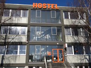 a building with a hospital sign on top of it at Hostel Stralsund in Stralsund