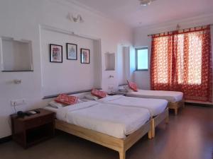 Tempat tidur dalam kamar di Jaiwana Haveli