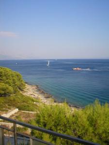 a view of the ocean with a boat in the water at Villa Adagio Apartments in Sumartin