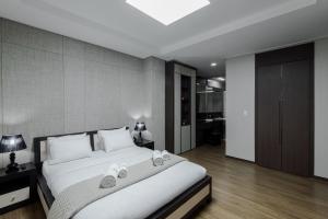 Katil atau katil-katil dalam bilik di Elite apartments
