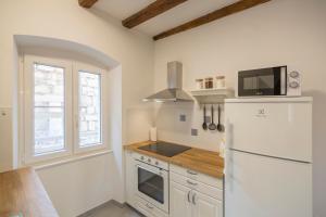 Kuchyň nebo kuchyňský kout v ubytování Apartments Bepi