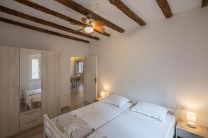 Postel nebo postele na pokoji v ubytování Apartments Bepi