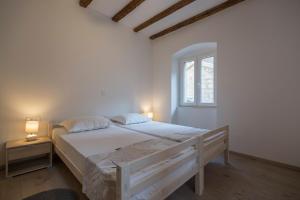 Postel nebo postele na pokoji v ubytování Apartments Bepi