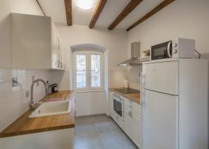 Kuchyň nebo kuchyňský kout v ubytování Apartments Bepi