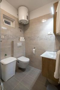 Koupelna v ubytování Apartments Bepi