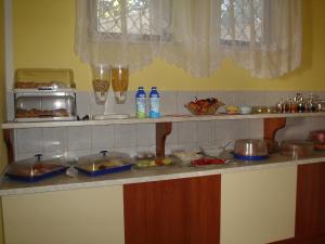 a kitchen counter with some food on it at Villa Adagio Apartments in Sumartin