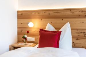 
Ein Bett oder Betten in einem Zimmer der Unterkunft Gästehaus Reichersbeuern
