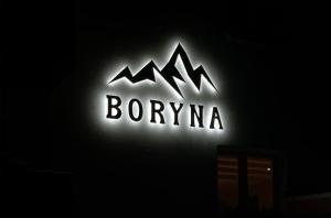 a neon sign that says bonyma on a building at Pokoje Gościnne Boryna in Szklarska Poręba