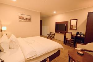 Ein Bett oder Betten in einem Zimmer der Unterkunft Hotel King's Palace
