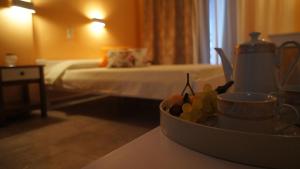 A bed or beds in a room at Idi
