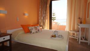 A bed or beds in a room at Idi
