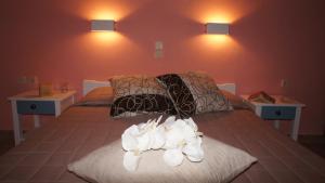 A bed or beds in a room at Idi