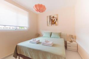 Posteľ alebo postele v izbe v ubytovaní SolApartment