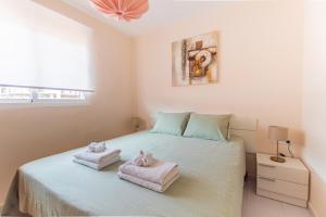 Posteľ alebo postele v izbe v ubytovaní SolApartment