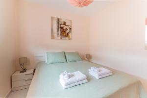 Posteľ alebo postele v izbe v ubytovaní SolApartment