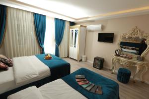 Postel nebo postele na pokoji v ubytování Constantinopolis Hotel