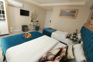 Postel nebo postele na pokoji v ubytování Constantinopolis Hotel