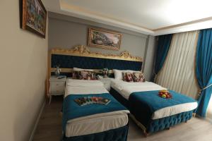 Postel nebo postele na pokoji v ubytování Constantinopolis Hotel