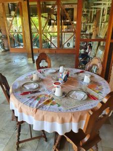 a table with plates of food on top of it at Pernambuco Club House in Guarujá