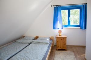 Posteľ alebo postele v izbe v ubytovaní Domki Szachulcowo