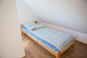 Posteľ alebo postele v izbe v ubytovaní Domki Szachulcowo