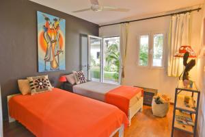 Postel nebo postele na pokoji v ubytování Tree Lodge Mauritius
