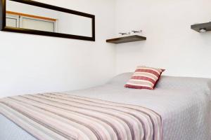 Säng eller sängar i ett rum på Apartamento en Palermo