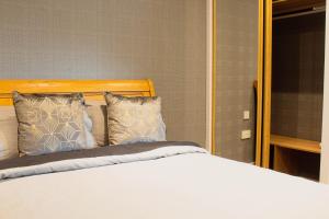 Postel nebo postele na pokoji v ubytování Forth Apartments