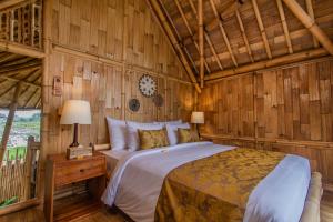 A bed or beds in a room at The Ipian by Pramana Villas
