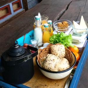 a table with a basket of food and bottles of milk at Laawu Kultainkoski in Kotka