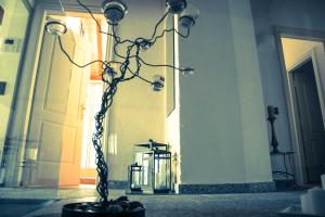 a vase with a chain around it in a building at CASA LUNA - WONDERFUL LAKE VIEW in Brione sopra Minusio