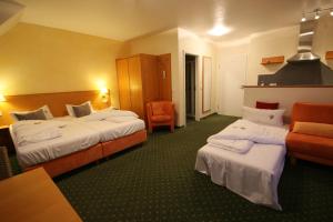 Postel nebo postele na pokoji v ubytování Berggasthof Hotel Igelwirt