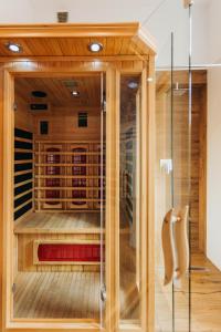 a room with a sauna with a glass door at Hotel 32 Kraków Old Town in Krakow