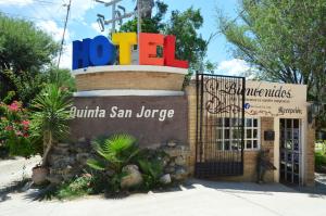 a sign for a juxtulum san jorge store with a building at Hotel Quinta San Jorge in Tula