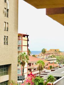 a view of the city from the balcony of a building at San Jose guesthouse Edificio S de Sol in Puerto de la Cruz