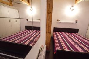 Posteľ alebo postele v izbe v ubytovaní Apartmani Nighty Night