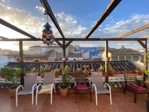 A balcony or terrace at El Granado Hostel