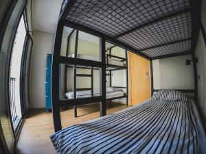 A bed or beds in a room at El Granado Hostel