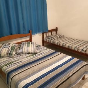 Postel nebo postele na pokoji v ubytování Pousada Recanto Do sagui
