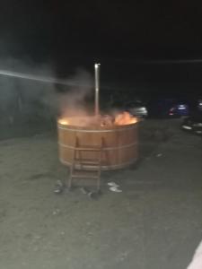 a hot tub in the middle of a street at night at LIVADA AMELY in Galeş