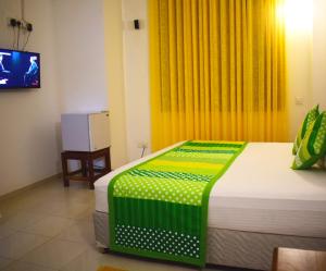 A bed or beds in a room at White Fortress