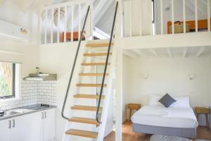 
A bed or beds in a room at Great Ocean Road Cottages
