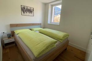 Säng eller sängar i ett rum på Apartments Griesser