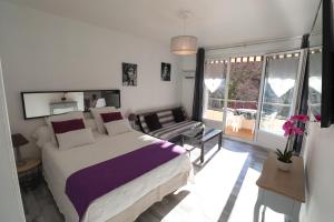 Ένα ή περισσότερα κρεβάτια σε δωμάτιο στο Locations appartements standing Amélie-les-bains