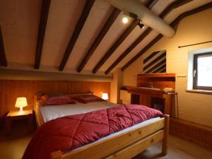 a bedroom with a large bed in a attic at Beautiful Holiday Home in Beverc with Sauna in Malmedy