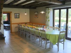 a dining room with a table and chairs at Beautiful Holiday Home in Beverc with Sauna in Malmedy