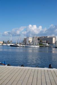 a group of boats docked in a marina at Bed à Cala in Palermo
