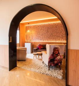 an archway in a living room with a couch at El Tambo 1 in Lima